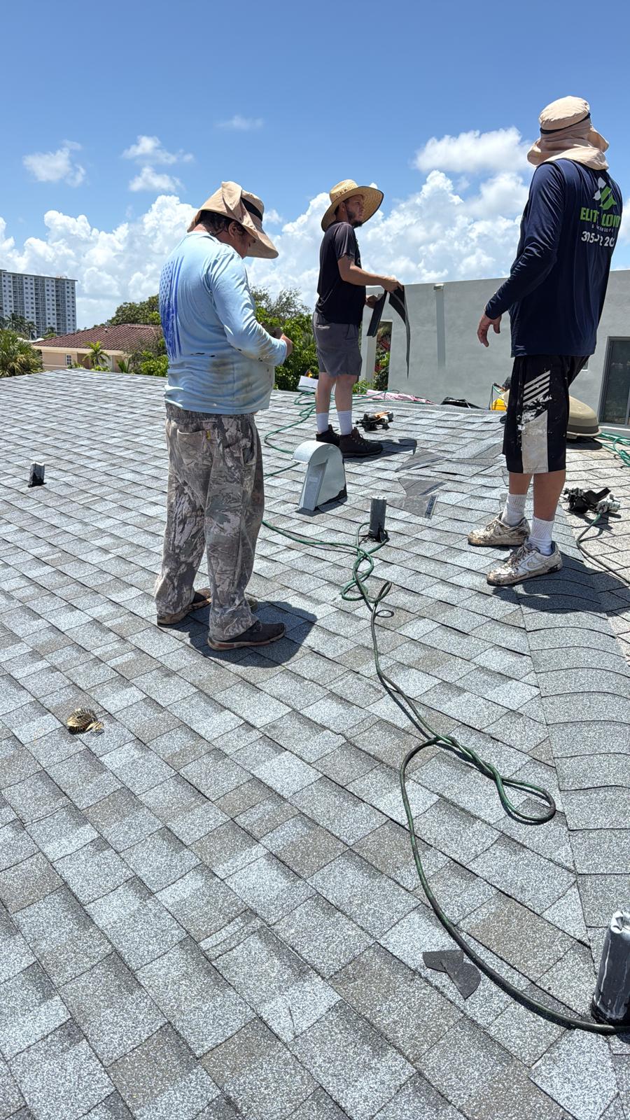 Beavers Roofing crew installing an architectural shingle roof in South Florida
